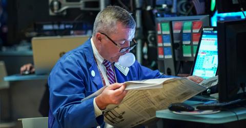 Trader looking at newspaper