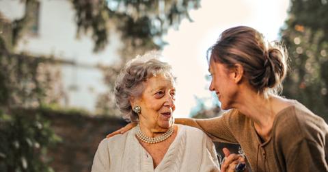 Adult daughter with a happy senior mother