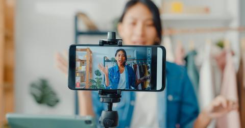 Woman recording video on phone