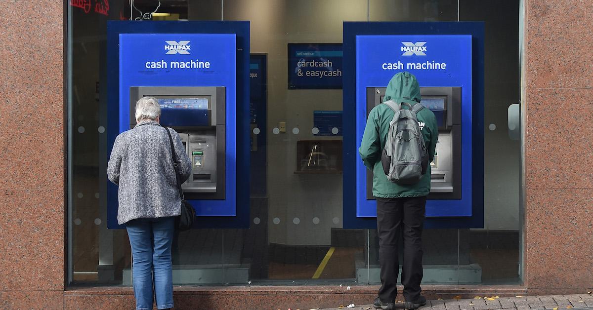 People withdrawing money from ATMs