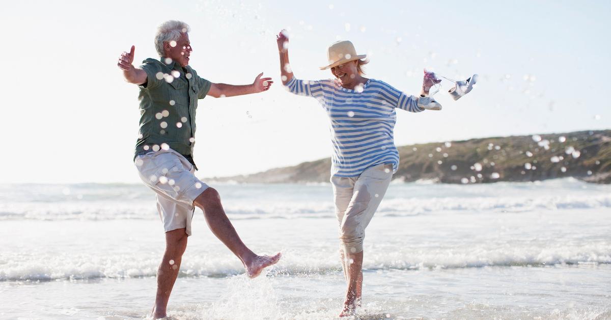 couple splashing in the ocean