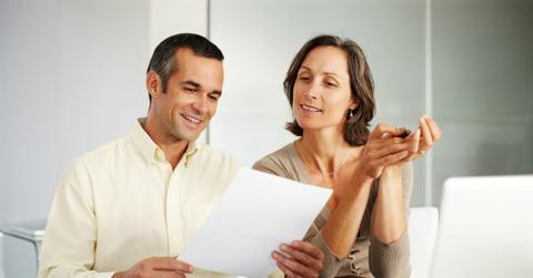 People looking at tax forms