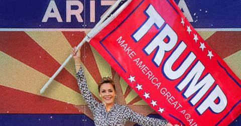 Kari Lake holding a Trump flag