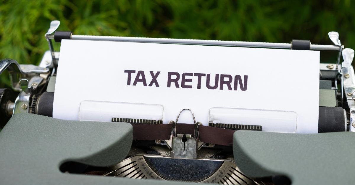 Tax Return written on a piece of paper.