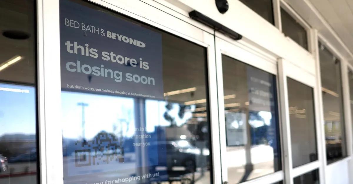 A Bed Bath & Beyond store sign on door warns customers its closing.