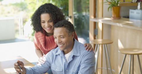 A couple looking at tuition bills