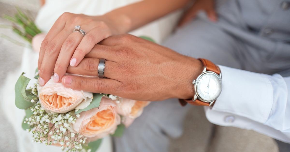 The hands of a married couple.