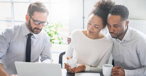 People looking at a laptop