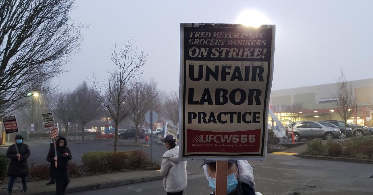 Kroger union workers holding picket signs