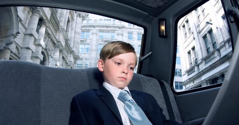 A young boy in a suit for 'Take Your Child to Work Day'