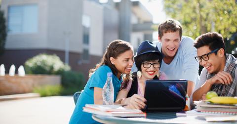 Students looking a Form 1098-T on a laptop