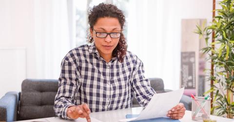 A woman calculating her taxes