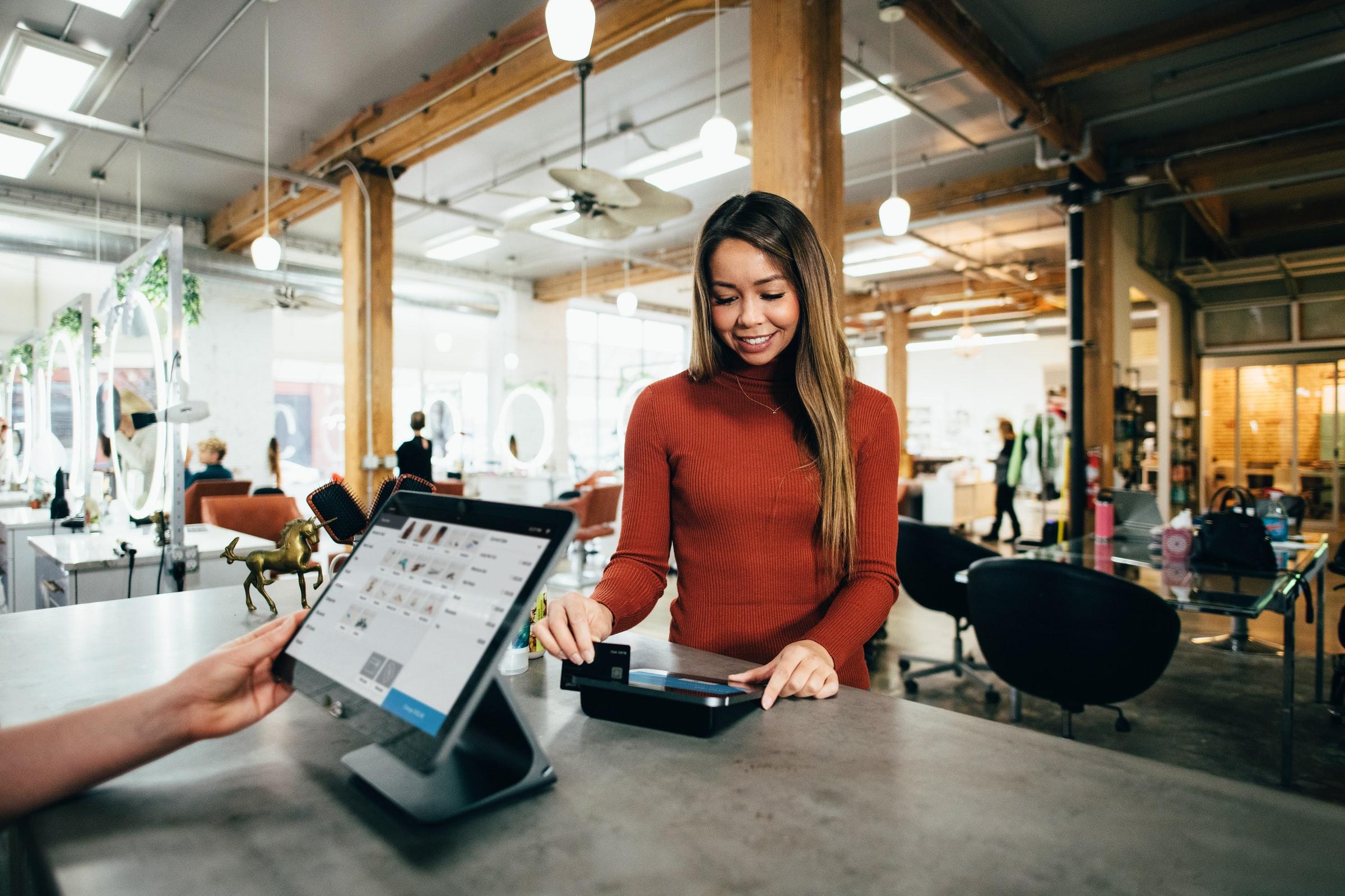 Woman using a payment machine