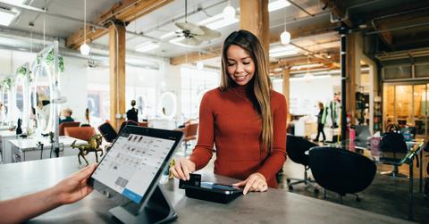 Woman using a payment machine