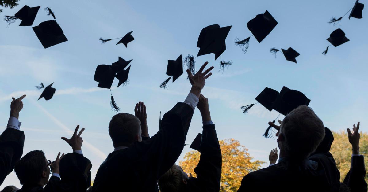 Graduates throwing caps