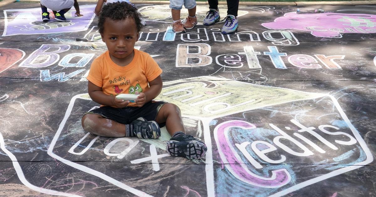 A child sitting around drawing of child tax credit