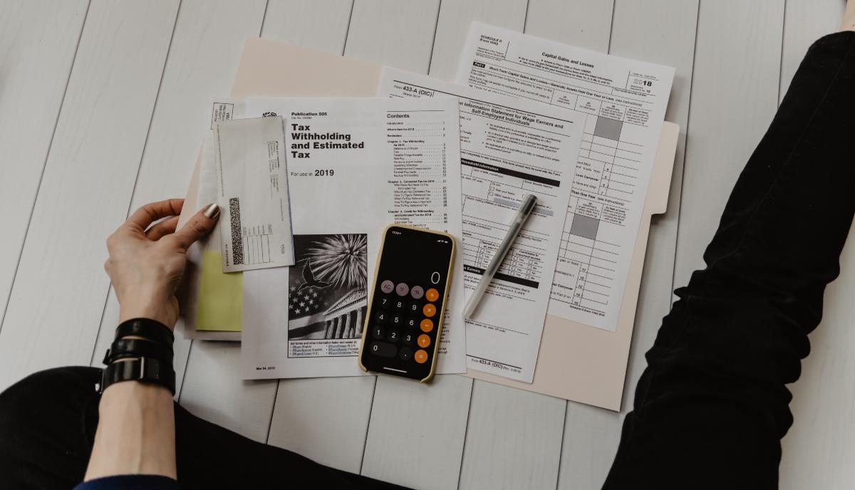 A person completing tax paperwork