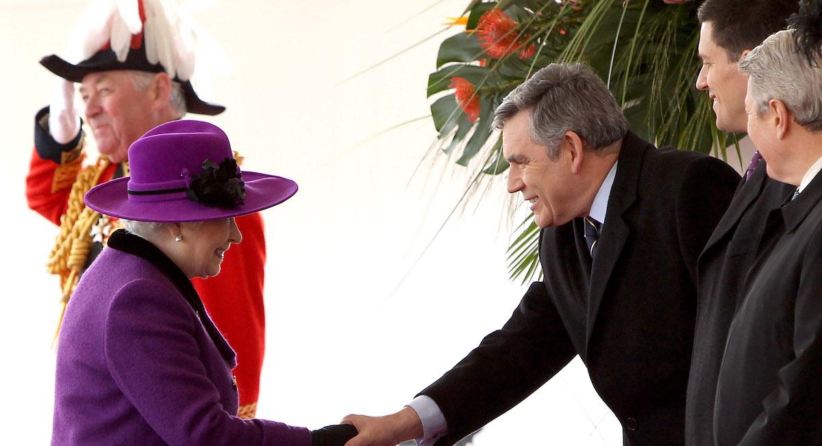 Queen Elizabeth II shaking hands with Gordon Brown.