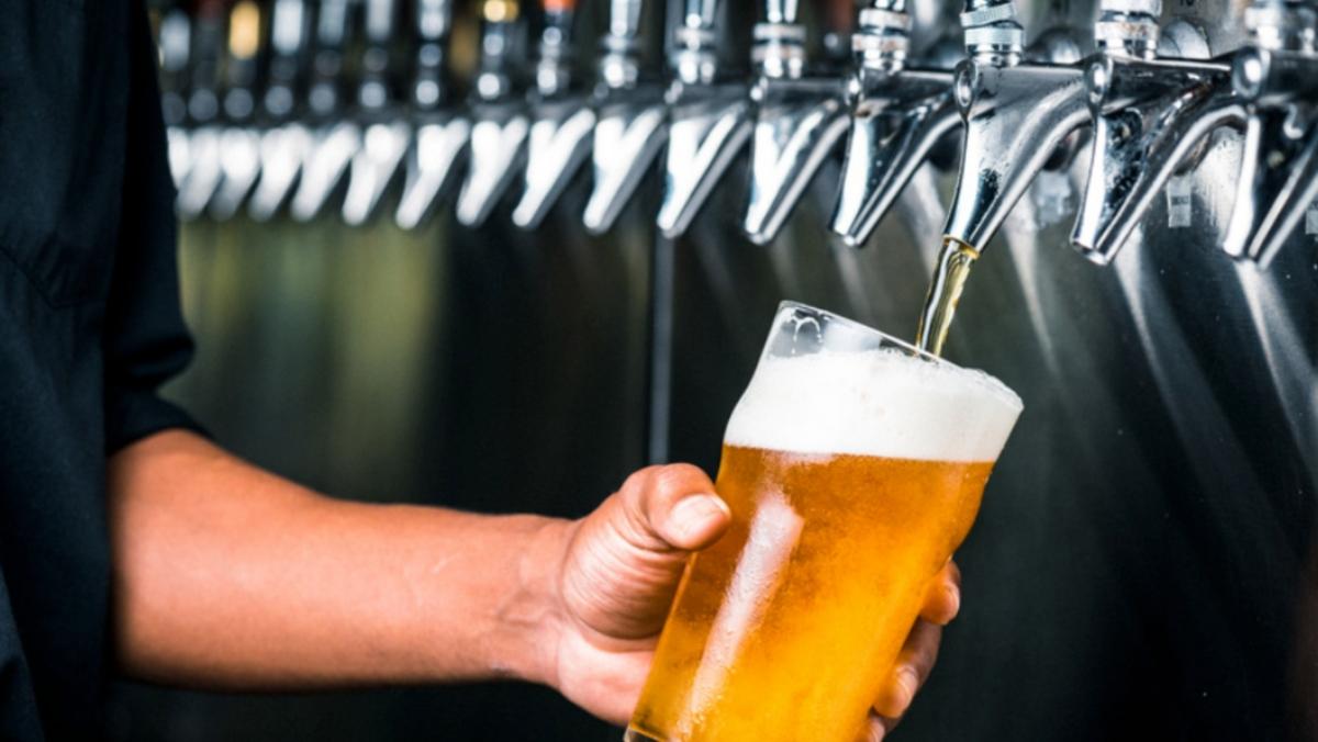 A person pouring a beer