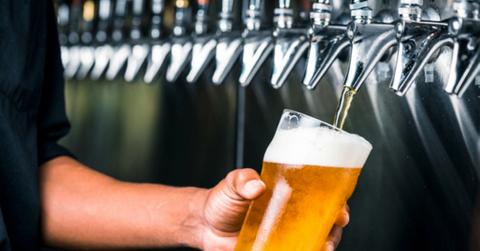 A person pouring a beer