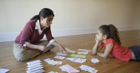 A woman looking at bills