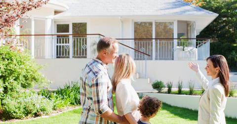 Female realtor showing a house for sale