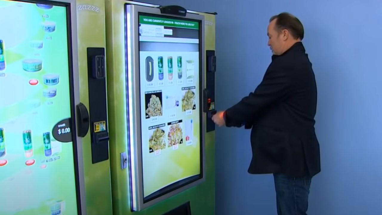 A man using a weed vending machine