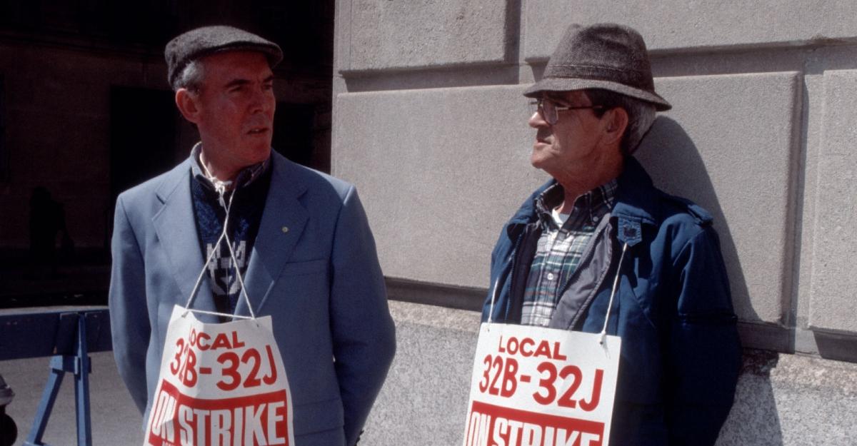 Two members of the doormen union on strike in 1991, wearing hats
