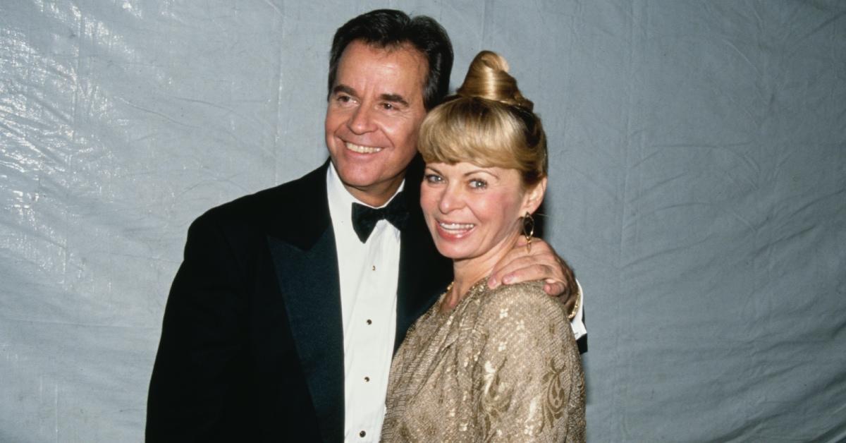 Dick Clark posing with his wife Kari Clark.