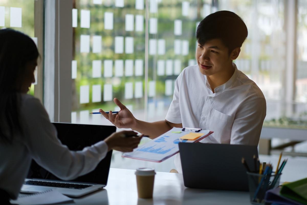 Two people talking about alternative investment funds