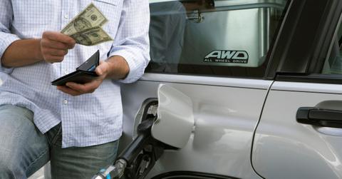 A person paying for gas at a pump