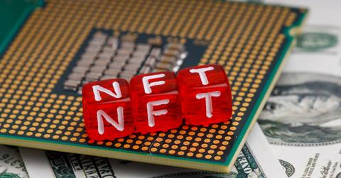 Letter blocks spelling "NFT" on a computer chip