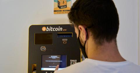 Person at bitcoin ATM