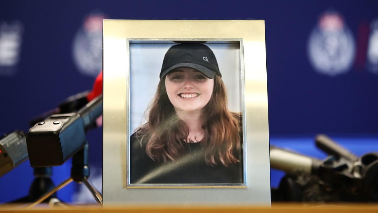 A photo of Grace Millane at a police press conference