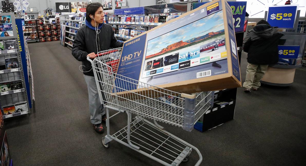 A man buying a TV on Black Friday.