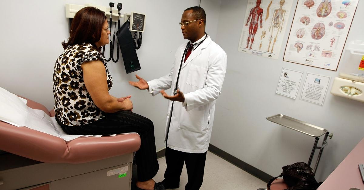 A woman talking to her doctor about Medicaid