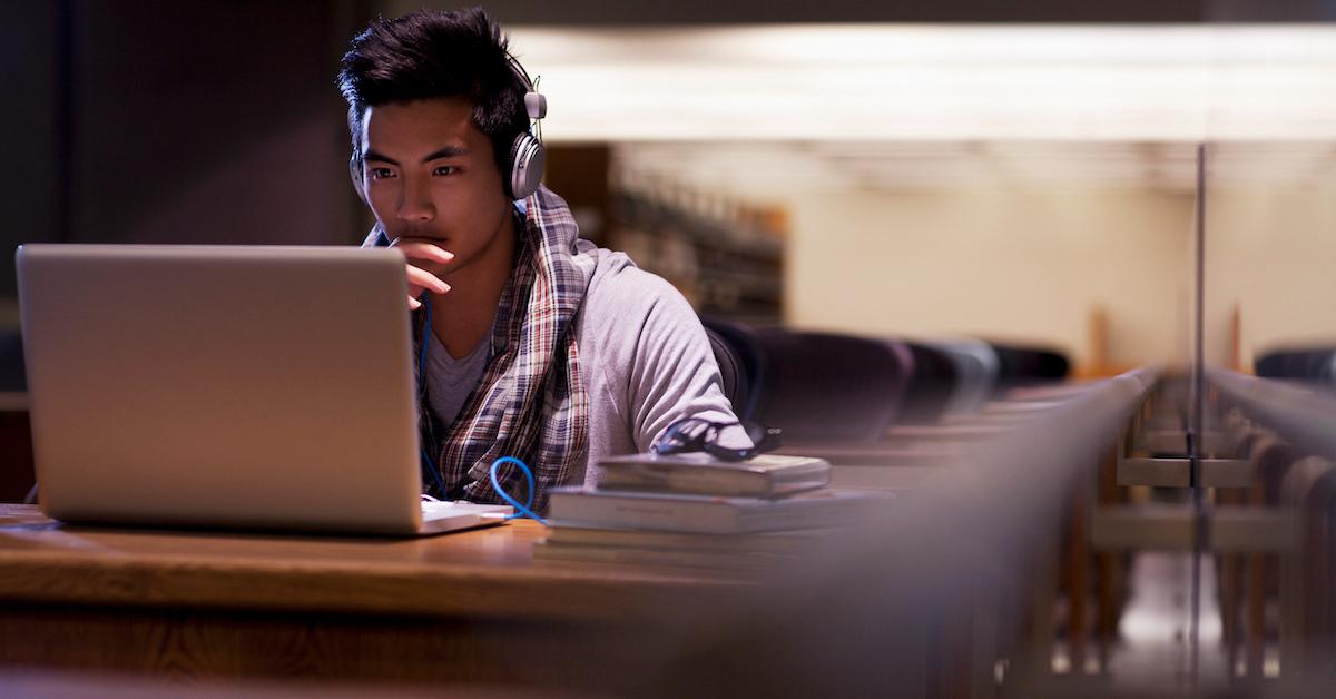 College student looking on a laptop