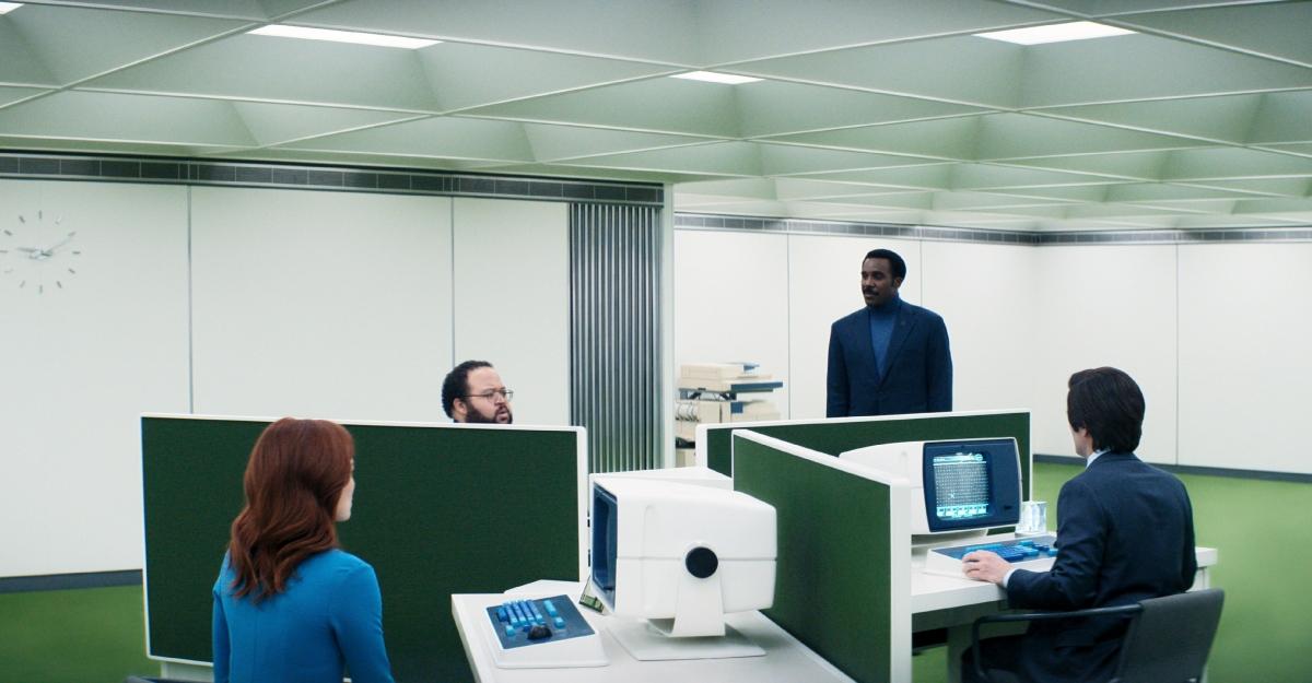 Office workers sit at their cubicles in Severance.