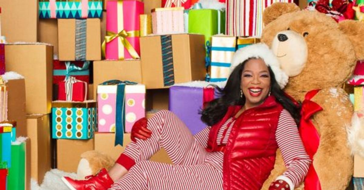 Oprah Winfrey posing among Christmas presents