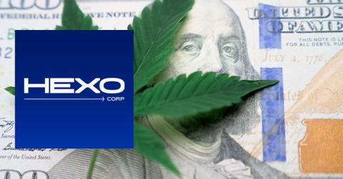 Cannabis leaf over 100 dollar bill