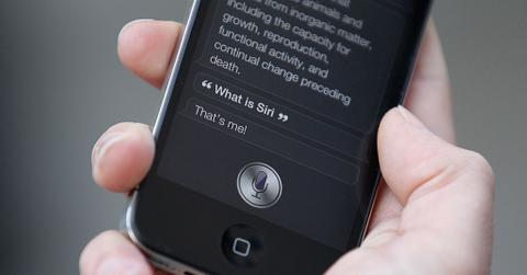 A person uses Siri on the new iPhone