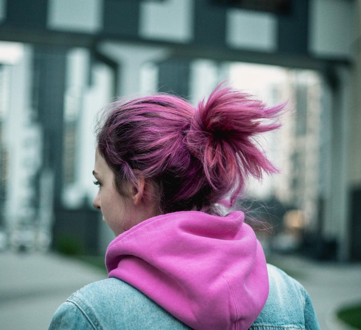 A woman with pink hair