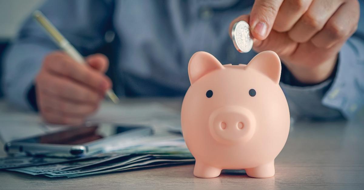 A person using a piggy bank