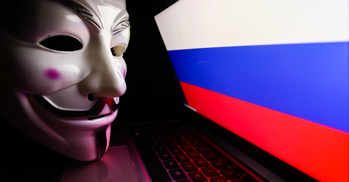 Anonymous mask against Russian flag in background