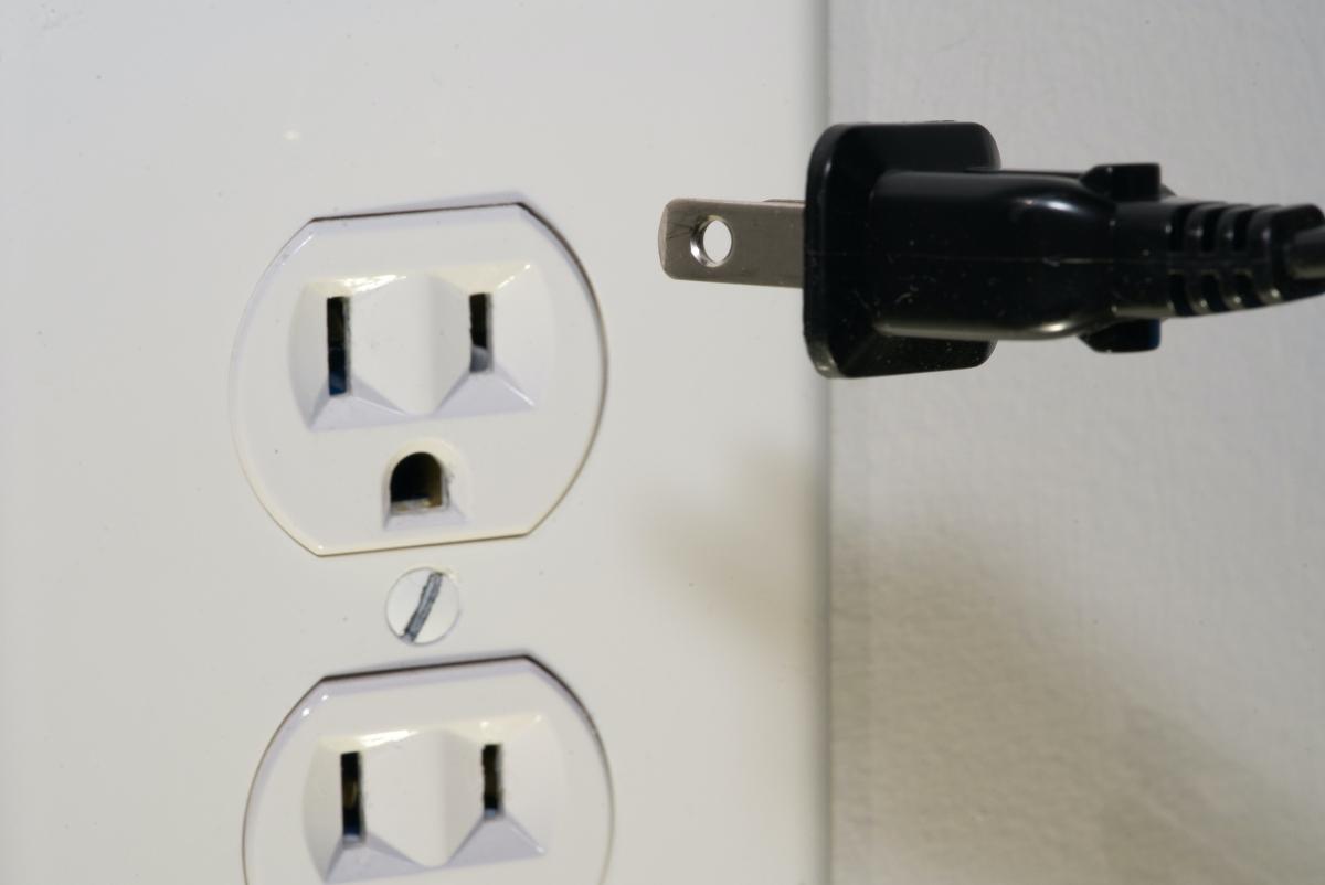 An electrical outlet and plug