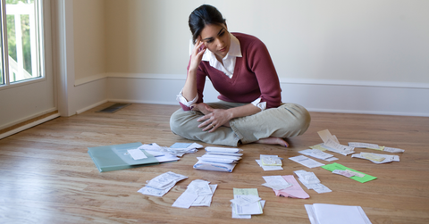 A woman looking at her bills