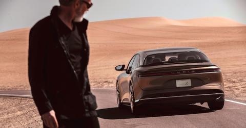 Man looking at a Lucid Air