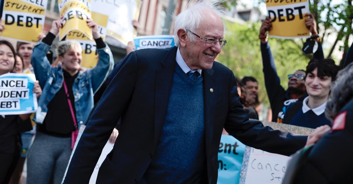 Sen. Bernie Sanders (I-VT) waves after speaking at a Student Loan Forgiveness rally.