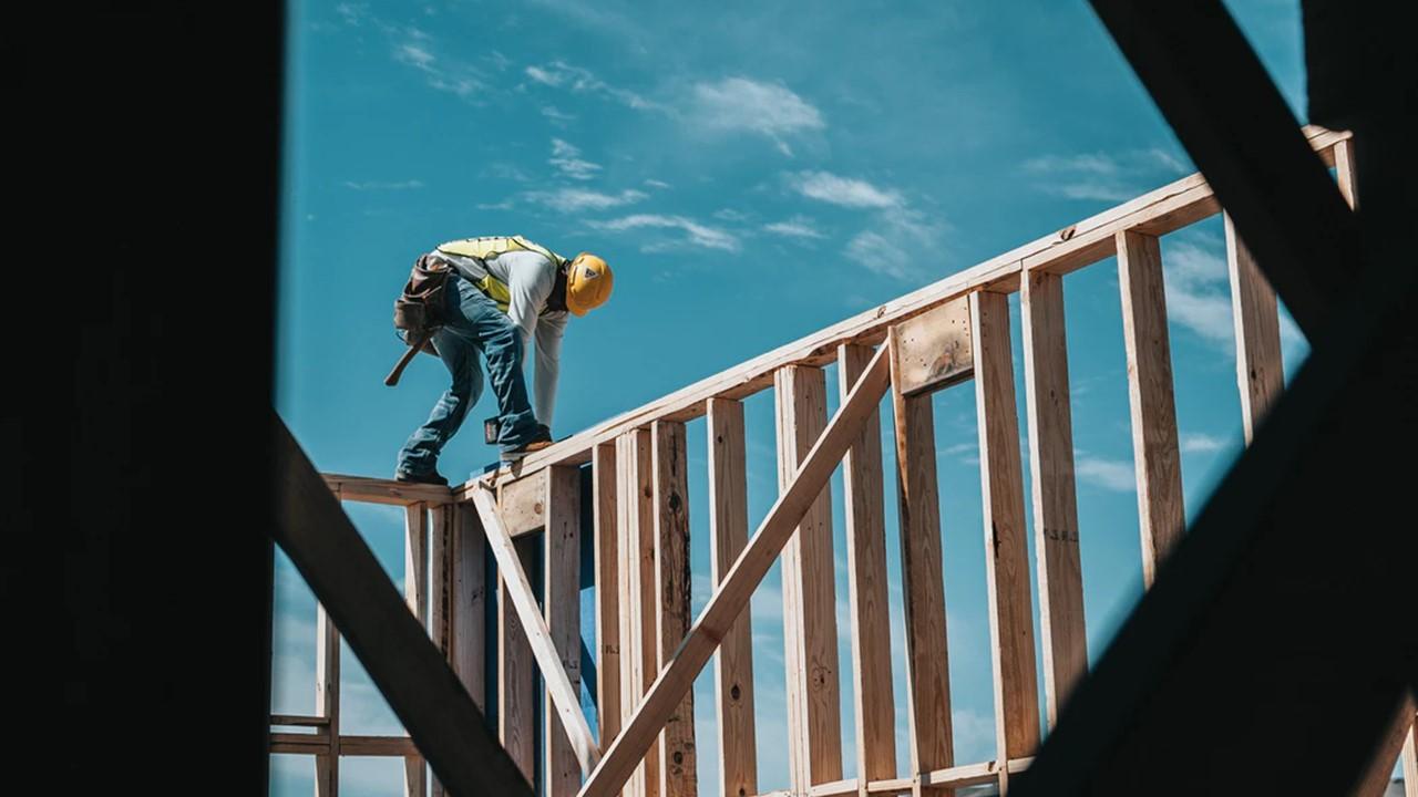 Man building a house frame