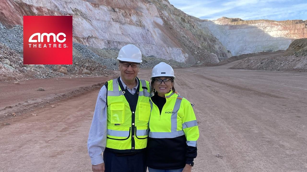 AMC CEO Adam Aron and Hycroft Mining CEO and President Diane Garrett and the AMC logo